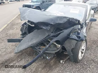 2015 Tesla Model S 85D with VIN 5YJSA1H23FFP79020, listed as a IAAI auction lot 41819392 with Not Provided miles. Bid and sale history available at carsss.com. Image 6.