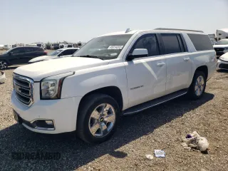 2015 GMC Yukon XL SLT with VIN 1GKS1HKCXFR502843, listed as a Copart auction lot 45014205 with 211,934 mi miles and Salvage Title. Bid and sale history available at carsss.com. Image 1.