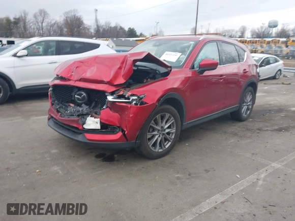 2020 Mazda CX-5 Grand Touring with VIN JM3KFADMXL0842026, listed as a IAAI auction lot 41477339 with 60,755 mi miles. Bid and sale history available at carsss.com. Image 17.