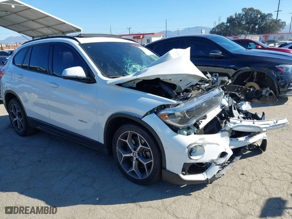 2016 BMW X1 xDrive28i with VIN WBXHT3C32G5E51855, listed as a IAAI auction lot 41634237 with 69,101 mi miles. Bid and sale history available at carsss.com. Image 1.