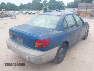 2000 Saturn SL z VIN 1G8ZF5280YZ108657, wystawiony jako IAAI lot #42414854 z przebiegiem 240 619 mil mil oraz . Historia ofert i sprzedaży dostępna na DreamBid. Obrazek 4.
