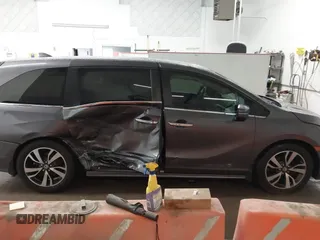 2021 Honda Odyssey Touring with VIN 5FNRL6H86MB026038, listed as a IAAI auction lot 41735249 with 68,480 mi miles. Bid and sale history available at carsss.com. Image 13.