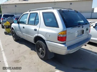 1998 Isuzu Rodeo S with VIN 4S2CM58WXW4325350, listed as a IAAI auction lot 42084411 with 292,784 mi miles. Bid and sale history available at carsss.com. Image 3.