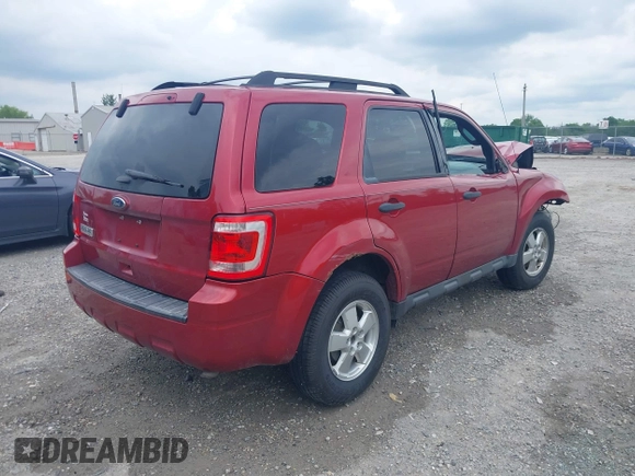 2012 Ford Escape XLT with VIN 1FMCU0D71CKC62929, listed as a IAAI auction lot 42523879 with 143,533 mi miles and . Bid and sale history available at DreamBid. Image 4.