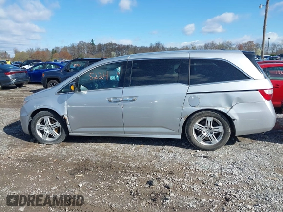 2011 Honda Odyssey Touring with VIN 5FNRL5H92BB049901, listed as a IAAI auction lot 41985224 with 101,957 mi miles and . Bid and sale history available at DreamBid. Image 14.