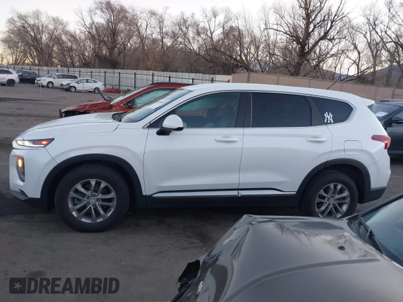 2019 Hyundai Santa Fe SE z VIN 5NMS23AD9KH077362, wystawiony jako IAAI lot #41890584 z przebiegiem 132 476 mil mil oraz . Historia ofert i sprzedaży dostępna na DreamBid. Obrazek 14.