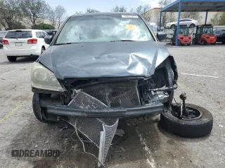 2005 Honda Odyssey EX-L with VIN 5FNRL38645B049087, listed as a Copart auction lot 56891275 with 194,587 mi miles and Salvage title. Bid and sale history available at DreamBid. Image 5.
