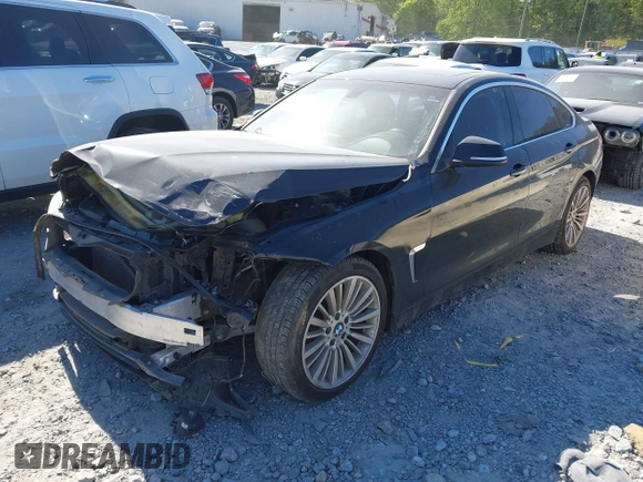 2015 BMW 4 Series 428i with VIN WBA4A5C51FG051393, listed as a IAAI auction lot 42041960 with 136,929 mi miles and . Bid and sale history available at carsss.com. Image 2.