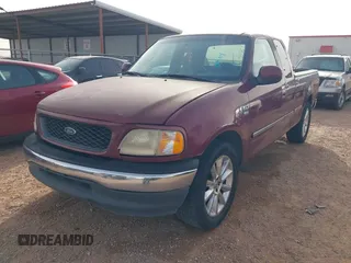 1998 Ford F-150 with VIN 1FTZX17WXWKB63416, listed as a IAAI auction lot 41604048 with 214,890 mi miles and . Bid and sale history available at DreamBid. Image 2.