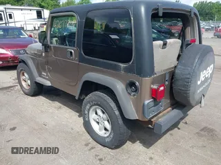 2005 Jeep Wrangler Sport with VIN 1J4FA49SX5P317120, listed as a IAAI auction lot 42677397 with 71,403 mi miles and . Bid and sale history available at DreamBid. Image 3.