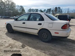 1998 Mazda Protege DX z VIN JM1BC1416W0194406, wystawiony jako Copart lot #44535955 z przebiegiem 312 942 mil mil oraz Szkoda całkowita • Salvage title. Historia ofert i sprzedaży dostępna na DreamBid. Obrazek 2.