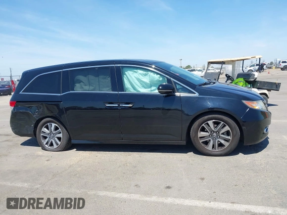 2014 Honda Odyssey Touring with VIN 5FNRL5H99EB133864, listed as a IAAI auction lot 42201359 with 122,490 mi miles and . Bid and sale history available at DreamBid. Image 13.
