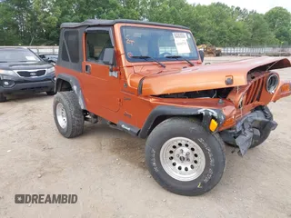 2001 Jeep Wrangler Sport z VIN 1J4FA49S01P341940, wystawiony jako IAAI lot #42542715 z przebiegiem 87 651 mil mil oraz . Historia ofert i sprzedaży dostępna na DreamBid. Obrazek 1.