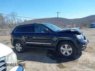 2011 Jeep Grand Cherokee Laredo with VIN 1J4RR4GG3BC670712, listed as a IAAI auction lot 41738127 with 93,714 mi miles and . Bid and sale history available at DreamBid. Image 13.