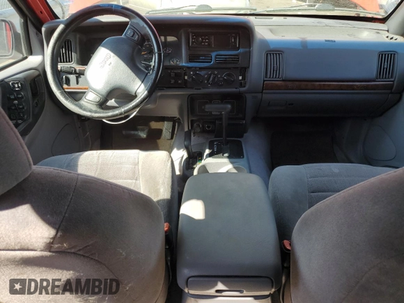 1996 Jeep Grand Cherokee Laredo with VIN 1J4GZ58S0TC170623, listed as a Copart auction lot 68019014 with 174,192 mi miles and Salvage Title. Bid and sale history available at carsss.com. Image 8.