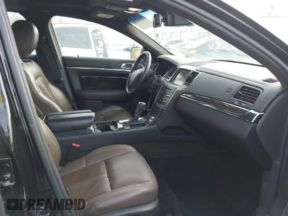 2013 Lincoln MKS with VIN 1LNHL9DK6DG608673, listed as a IAAI auction lot 42756289 with 103,118 mi miles and . Bid and sale history available at DreamBid. Image 5.