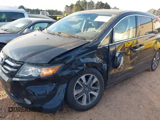 2014 Honda Odyssey Touring with VIN 5FNRL5H90EB077054, listed as a IAAI auction lot 41904456 with 197,869 mi miles and . Bid and sale history available at carsss.com. Image 6.