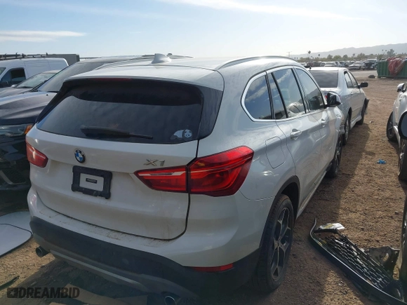 2018 BMW X1 sDrive28i with VIN WBXHU7C32J5H41587, listed as a IAAI auction lot 41538394 with 125,804 mi miles. Bid and sale history available at carsss.com. Image 4.