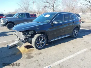 2018 BMW X1 xDrive28i with VIN WBXHT3C36J5F91110, listed as a IAAI auction lot 41757293 with 80,327 mi miles. Bid and sale history available at carsss.com. Image 2.