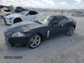 2007 Jaguar XK with VIN SAJWA44C779B12243, listed as a Copart auction lot 77239534 with 0 mi miles and Salvage Title. Bid and sale history available at carsss.com. Image 1.