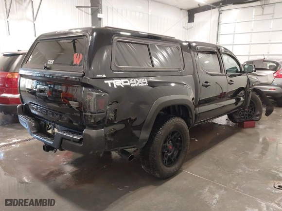 2020 Toyota Tacoma 4WD SR5 with VIN 3TMCZ5AN4LM338884, listed as a IAAI auction lot 41835157 with 78,874 mi miles. Bid and sale history available at carsss.com. Image 4.