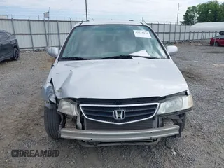 2004 Honda Odyssey EX-L z VIN 5FNRL189X4B013837, wystawiony jako IAAI lot #42215471 z przebiegiem 208 729 mil mil oraz . Historia ofert i sprzedaży dostępna na DreamBid. Obrazek 13.