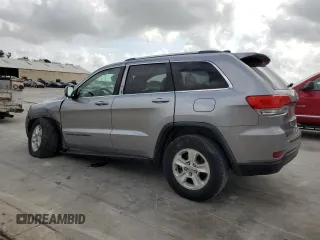 2017 Jeep Grand Cherokee Laredo with VIN 1C4RJEAG0HC664063, listed as a Copart auction lot 54850295 with 82,913 mi miles and Salvage title. Bid and sale history available at DreamBid. Image 2.