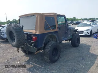 2006 Jeep Wrangler Sport z VIN 1J4FA49S66P708332, wystawiony jako IAAI lot #42402995 z przebiegiem 130 795 mil mil oraz . Historia ofert i sprzedaży dostępna na DreamBid. Obrazek 4.