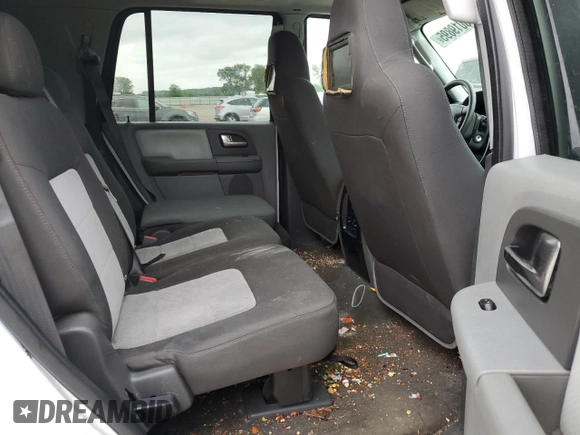 2004 Ford Expedition Special Service with VIN 1FMEU15W04LB07353, listed as a Copart auction lot 58019895 with 230,542 mi miles and Salvage title. Bid and sale history available at DreamBid. Image 11.