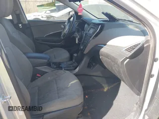2016 Hyundai Santa Fe z VIN 5XYZUDLB9GG337402, wystawiony jako IAAI lot #41761929 z przebiegiem 112 560 mil mil oraz . Historia ofert i sprzedaży dostępna na DreamBid. Obrazek 5.