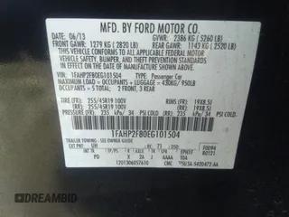 2014 Ford Taurus Limited with VIN 1FAHP2F80EG101504, listed as a IAAI auction lot 40974783 with 177,522 mi miles. Bid and sale history available at carsss.com. Image 9.