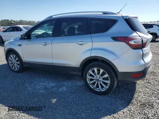 2017 Ford Escape Titanium with VIN 1FMCU0J90HUB04082, listed as a Copart auction lot 77814994 with 135,674 mi miles and Salvage Title. Bid and sale history available at carsss.com. Image 2.