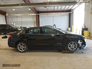 2016 Ford Fusion Titanium Hybrid with VIN 3FA6P0RU7GR127307, listed as a IAAI auction lot 41944427 with 128,076 mi miles. Bid and sale history available at carsss.com. Image 14.