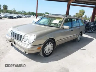 1999 Mercedes-Benz E-Class with VIN WDBJH65F3XA845635, listed as a IAAI auction lot 42102122 with 215,678 mi miles. Bid and sale history available at carsss.com. Image 2.