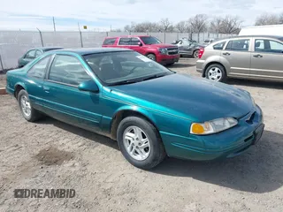 1997 Ford Thunderbird LX with VIN 1FALP62W7VH153454, listed as a IAAI auction lot 41833472 with 147,269 mi miles and . Bid and sale history available at DreamBid. Image 1.