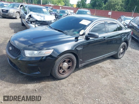 2014 Ford Police Interceptor with VIN 1FAHP2MK0EG170496, listed as a IAAI auction lot 42693683 with 147,921 mi miles and . Bid and sale history available at DreamBid. Image 18.