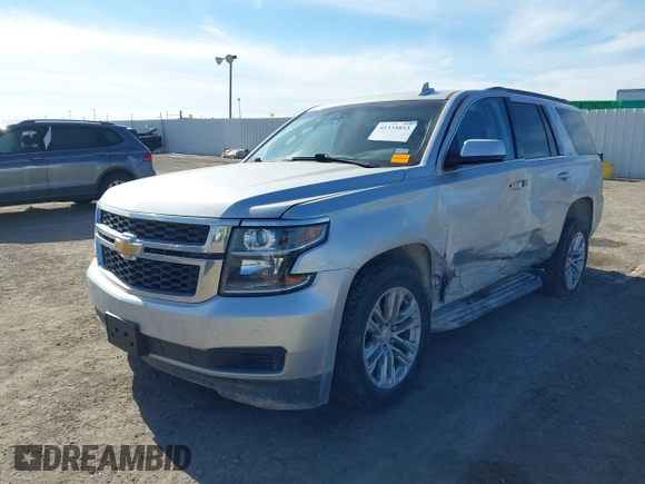 2020 Chevrolet Tahoe LT with VIN 1GNSCBKC5LR226822, listed as a IAAI auction lot 41334853 with 77,091 mi miles and . Bid and sale history available at DreamBid. Image 2.
