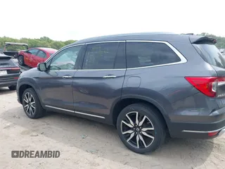 2020 Honda Pilot Elite with VIN 5FNYF6H00LB027472, listed as a IAAI auction lot 42253478 with 69,988 mi miles and . Bid and sale history available at DreamBid. Image 14.