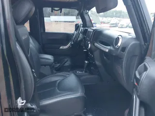 2016 Jeep Wrangler Unlimited 75th Anniversary with VIN 1C4BJWEG2GL158850, listed as a IAAI auction lot 41472080 with 109,789 mi miles. Bid and sale history available at carsss.com. Image 5.