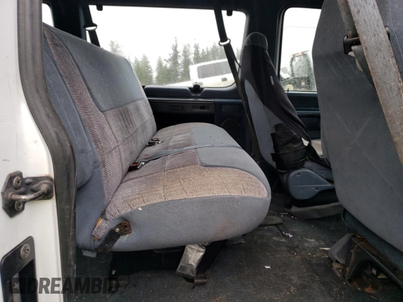 1994 Ford Econoline Wagon XL z VIN 1FBJS31H1RHB32773, wystawiony jako Copart lot #82008864 z przebiegiem Nie podano mil oraz Tytuł czysty. Historia ofert i sprzedaży dostępna na DreamBid. Obrazek 11.