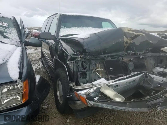 1997 Chevrolet Suburban with VIN 3GNFK16RXVG133472, listed as a Copart auction lot 48998175 with 180,543 mi miles and Salvage Title. Bid and sale history available at carsss.com. Image 12.