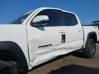 2023 Toyota Tacoma SR with VIN 3TMCZ5AN7PM630874, listed as a IAAI auction lot 40298041 with 8,635 mi miles and . Bid and sale history available at DreamBid. Image 6.