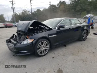 2011 Jaguar XJ with VIN SAJWA2GB4BLV15340, listed as a Copart auction lot 84138014 with 104,942 mi miles and Salvage Title. Bid and sale history available at carsss.com. Image 1.