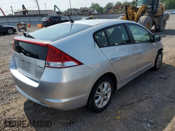 2010 Honda Insight EX with VIN JHMZE2H77AS015329, listed as a Copart auction lot 60502835 with 213,397 mi miles and Clean title. Bid and sale history available at DreamBid. Image 3.