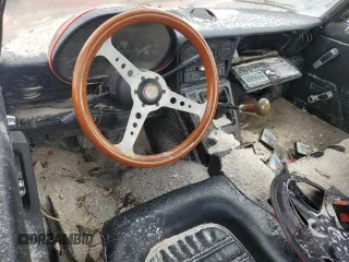 1988 Alfa Romeo Spider Graduate z VIN ZARBA5645J1062539, wystawiony jako Copart lot #75542014 z przebiegiem Nie podano mil oraz Szkody całkowita. Historia ofert i sprzedaży dostępna na DreamBid. Obrazek 8.