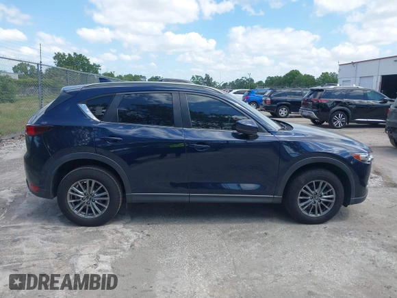 2017 Mazda CX-5 Touring with VIN JM3KFACL0H0227615, listed as a IAAI auction lot 42063618 with 72,291 mi miles. Bid and sale history available at carsss.com. Image 13.