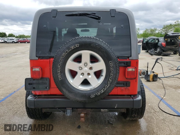 2005 Jeep Wrangler Sport z VIN 1J4FA49S75P317995, wystawiony jako Copart lot #58060055 z przebiegiem 189 332 mil mil oraz Szkoda całkowita • Salvage title. Historia ofert i sprzedaży dostępna na DreamBid. Obrazek 6.