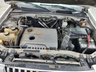 2009 Mercury Mariner Hybrid with VIN 4M2CU29369KJ14719, listed as a Copart auction lot 62511705 with 144,062 mi miles and Salvage title. Bid and sale history available at DreamBid. Image 12.