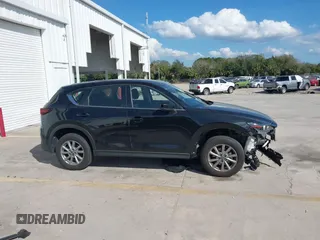 2023 Mazda CX-5 2.5 S with VIN JM3KFBAM3P0104813, listed as a IAAI auction lot 41540923 with 30,861 mi miles. Bid and sale history available at carsss.com. Image 14.