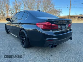 2018 BMW 5 Series M550i xDrive with VIN WBAJB9C55JB035226, listed as a Copart auction lot 57062675 with 156,183 mi miles and Clean title. Bid and sale history available at DreamBid. Image 3.